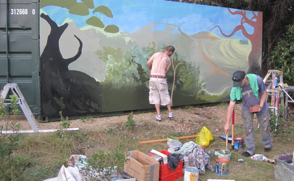 Artists work on the container at Cabarita Beach. Artists work on the container at Cabarita Beach.